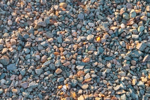 Close-up of crushed stones and rocks texture, perfect for construction stone supplier visuals