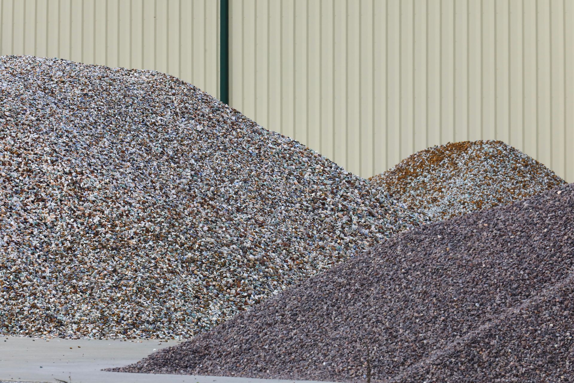 Several large piles of stones for residential landscaping project.