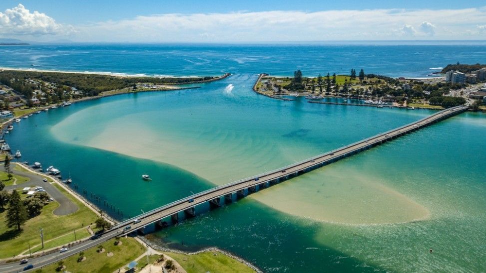 An Aerial View of a Bridge Over a Body of Water — Ryno's Plumbing Group in Forster, NSW