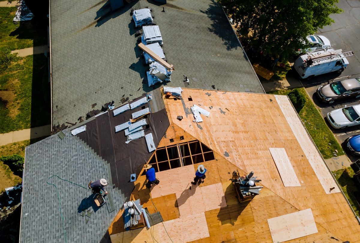 Commercial roofing services being performed on a business property in Atwater, CA