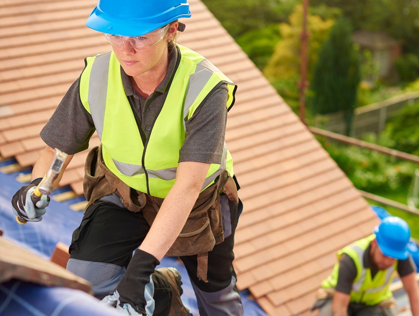 Experienced roofing professionals working on a home in Atwater