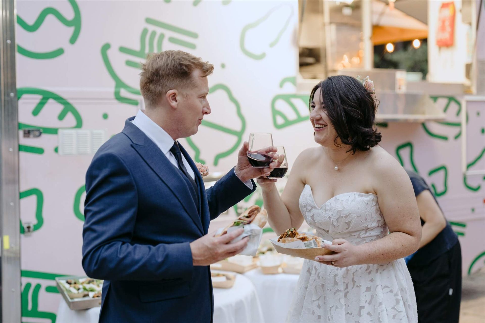 Wedding couple at sit-down reception with Nem N' Nem catering
