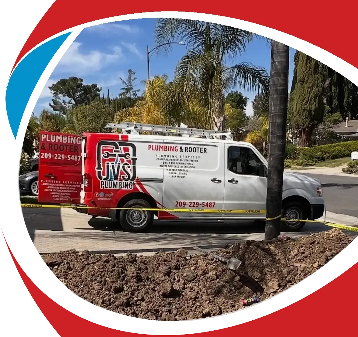 Red-and-white plumbing service van parked on a suburban street with trees and landscaping