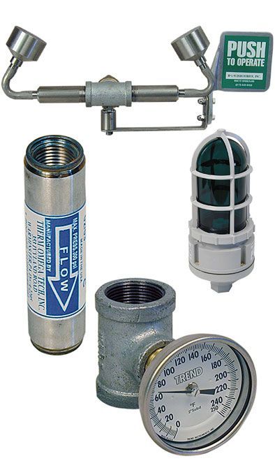 Assorted plumbing valves, fittings, and pressure gauges on a white background