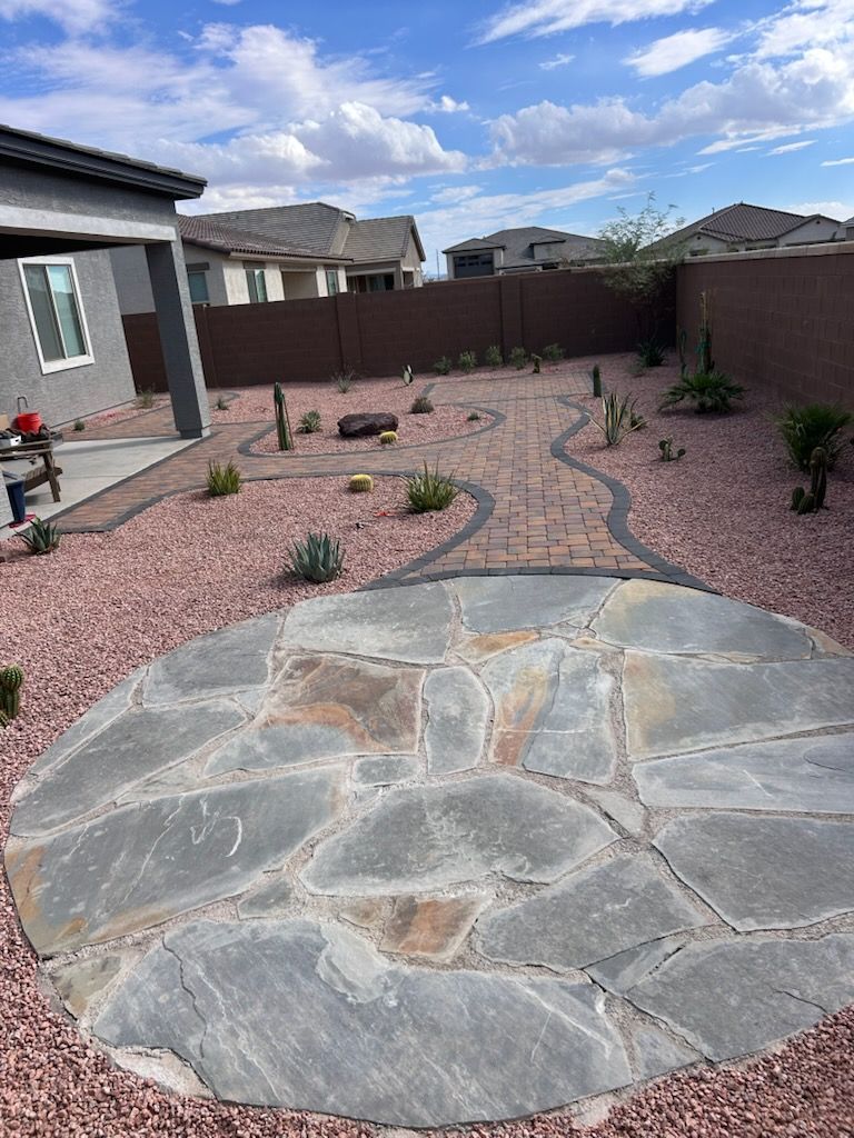 A house with a concrete sidewalk in front of it