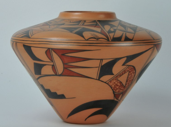 Decorative orange and black hand-painted ceramic vase with geometric and floral patterns