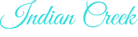 Turquoise cursive text reading “Indian Creek” on a white background