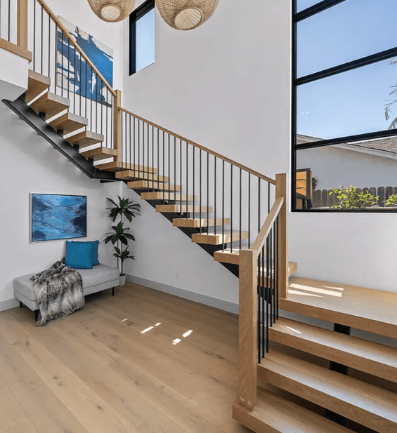 White Oak Staircase with modern design and Black Iron Balusters with Thick Floating Treads