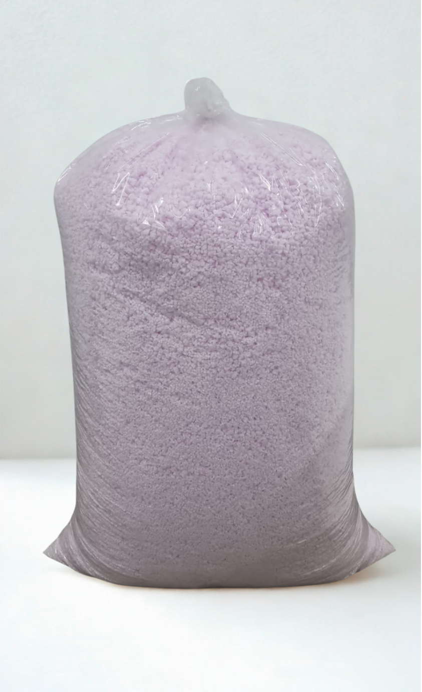 Bag of light purple granular material.