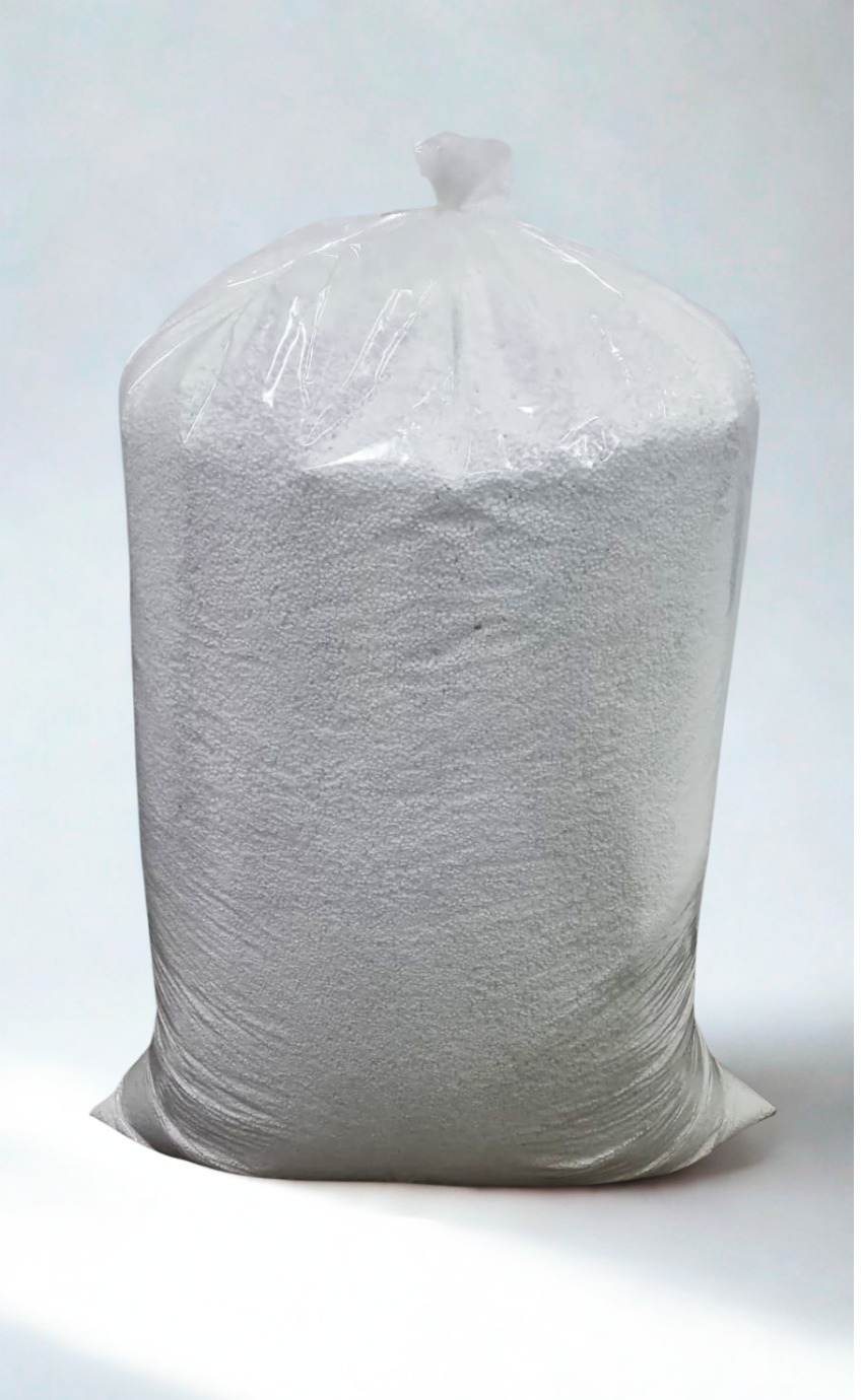 Bag of small, white, spherical pellets in a clear plastic bag, tied at the top, against a white background.