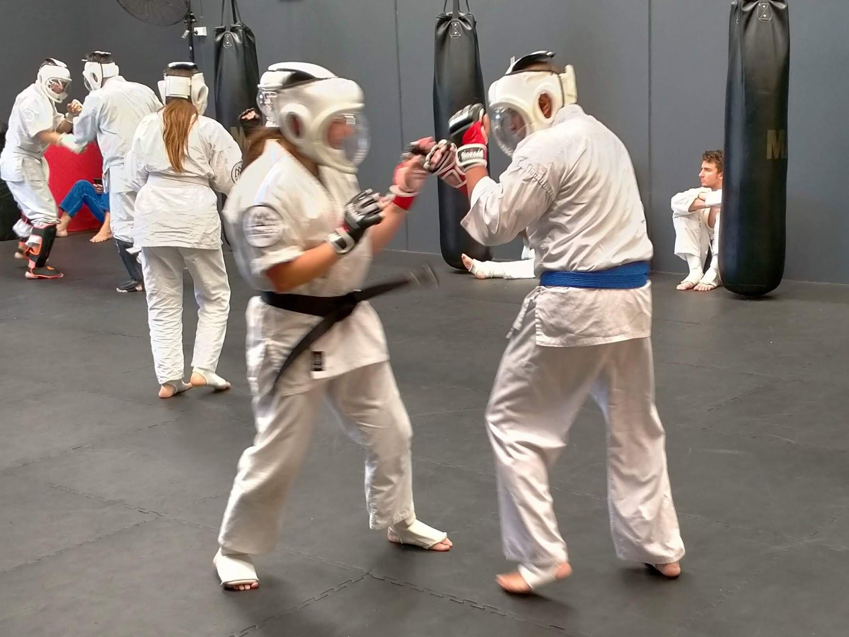 Karate sparring with headgear and gloves at Bushido Academy Moorabbin
