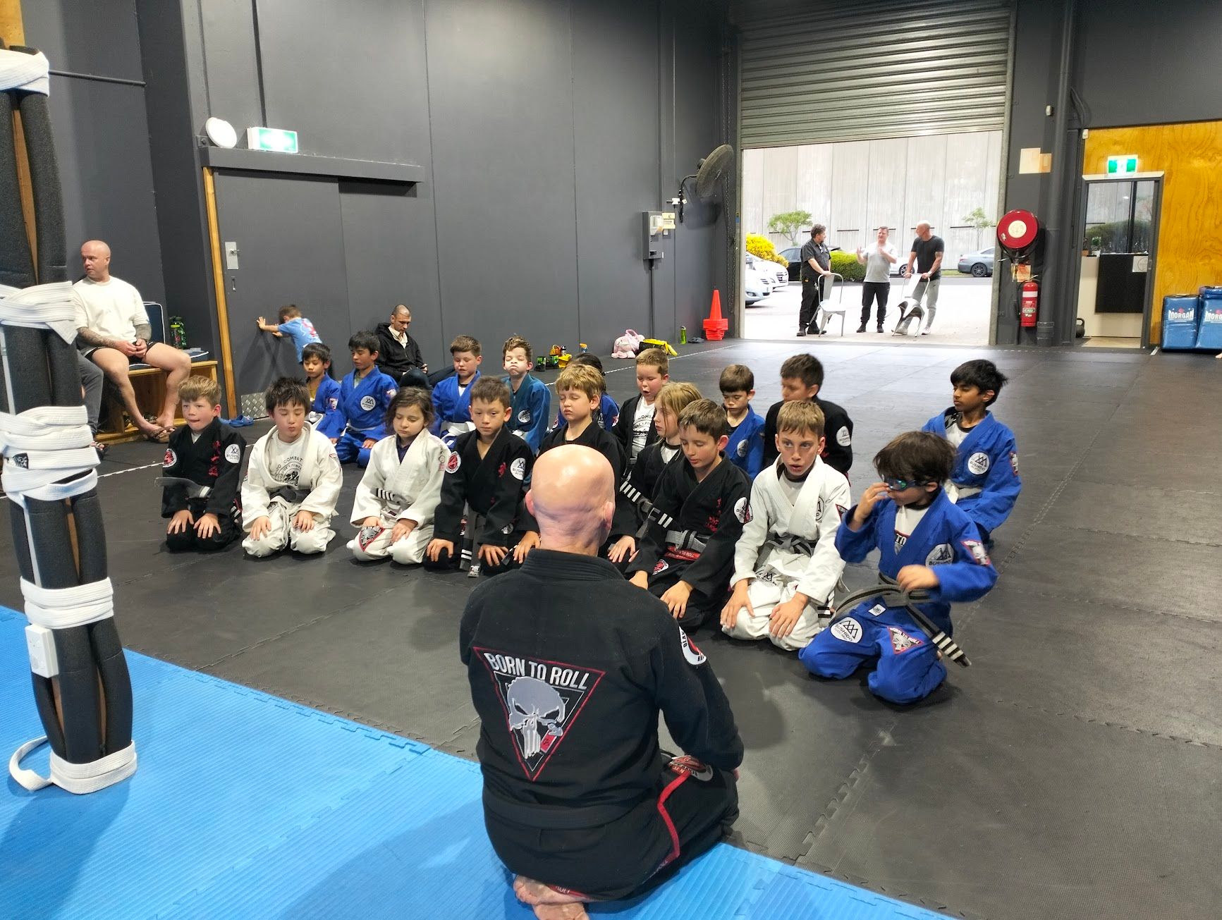 Kids class listening to their coach at Bushido Academy Moorabbin