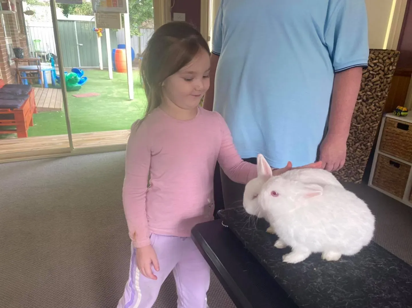 A Girl and Two Rabbits — Goulburn, NSW — River Heights Child Care Centre
