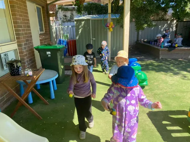 Kids Wearing Colourful Hats — Goulburn, NSW — River Heights Child Care Centre