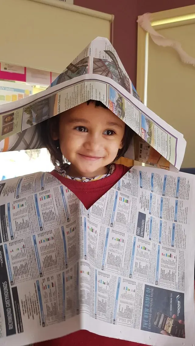 Kid in Newspaper Costume — Goulburn, NSW — River Heights Child Care Centre