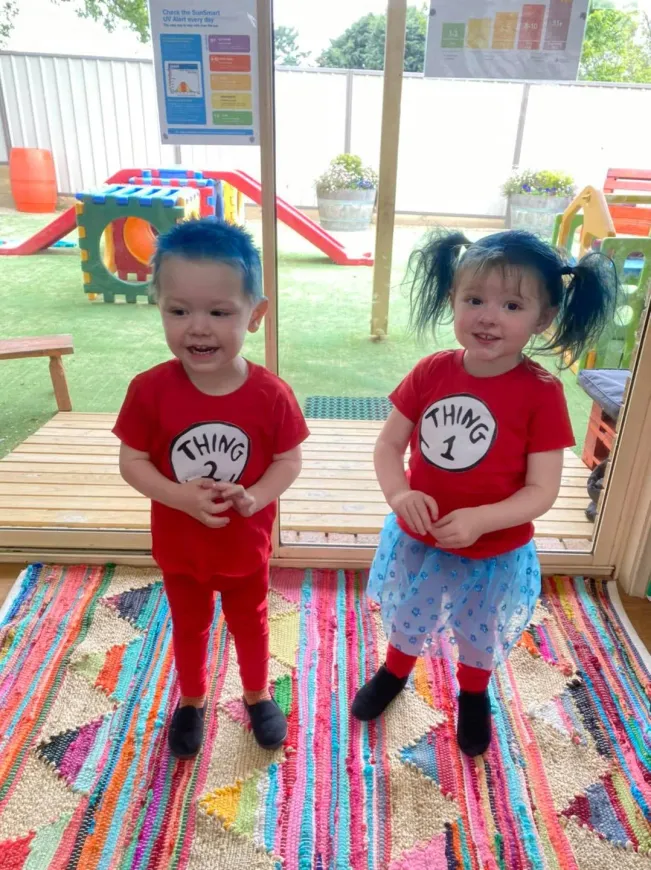 Two Kids Wearing Red Shirt — Goulburn, NSW — River Heights Child Care Centre