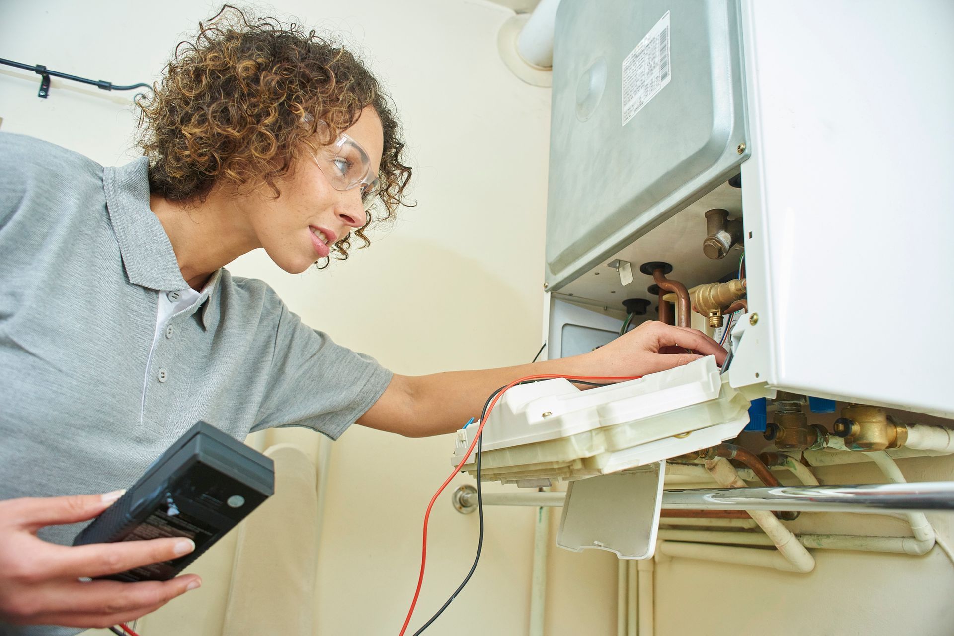 A heating contractor is testing a central heating boiler to ensure proper functionality.