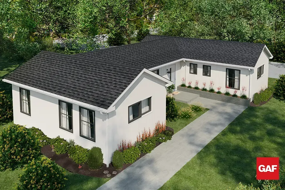 White single-story house with dark roof, front walkway, and landscaped yard under trees