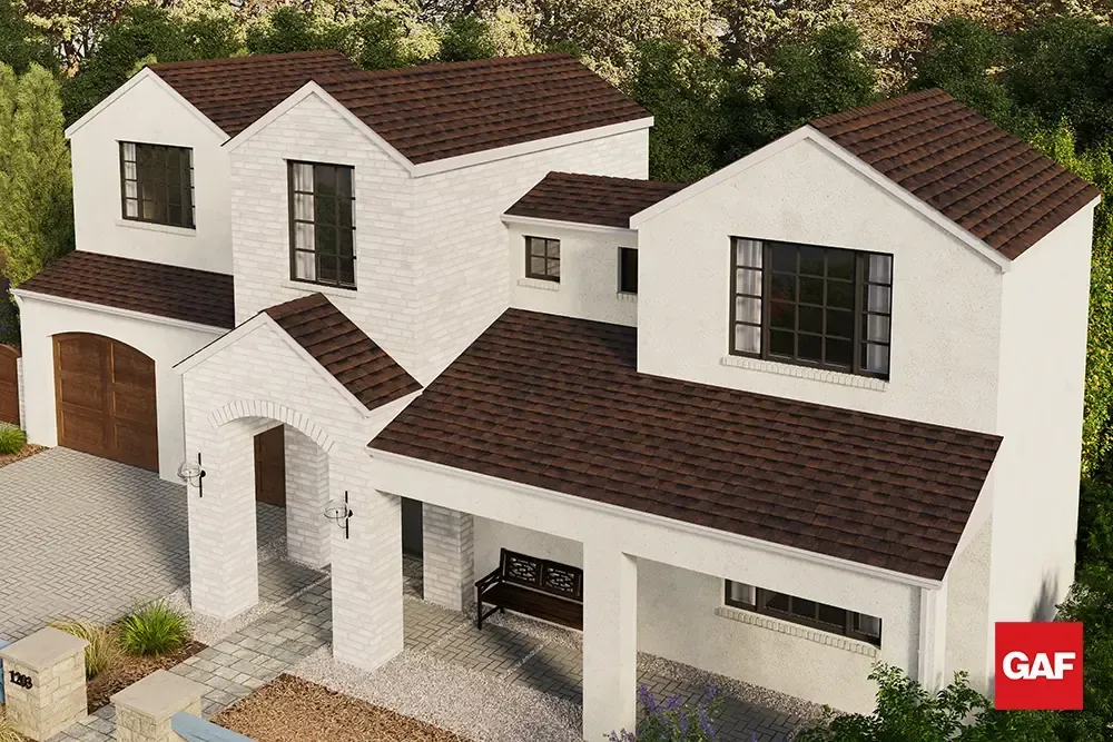 Modern two-story white house with dark brown roof and garage, shown in an aerial view