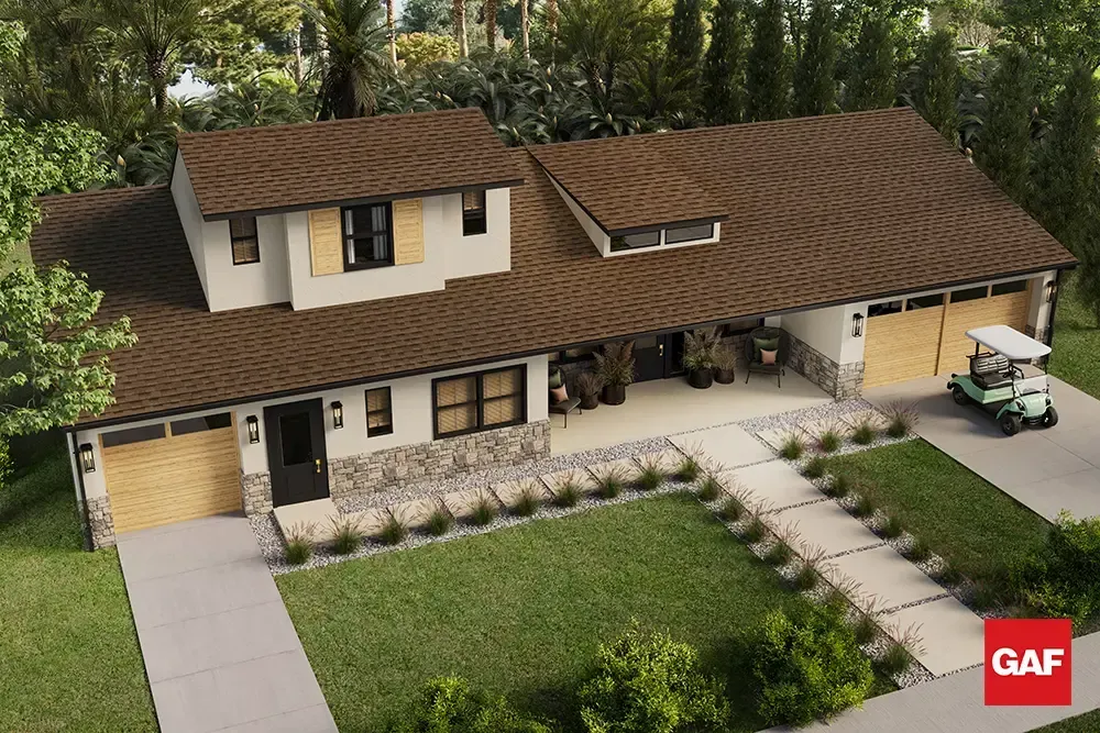 Aerial view of a beige house with brown roof, front lawn, and stone walkway, with a GAF logo in the corner