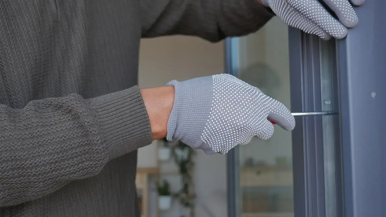 Man works on installing a window in a home