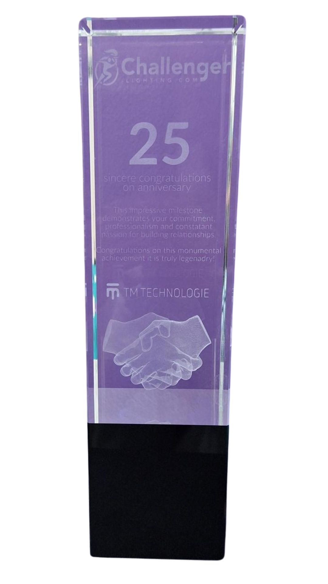 Trophy, clear glass with purple interior, black base. 