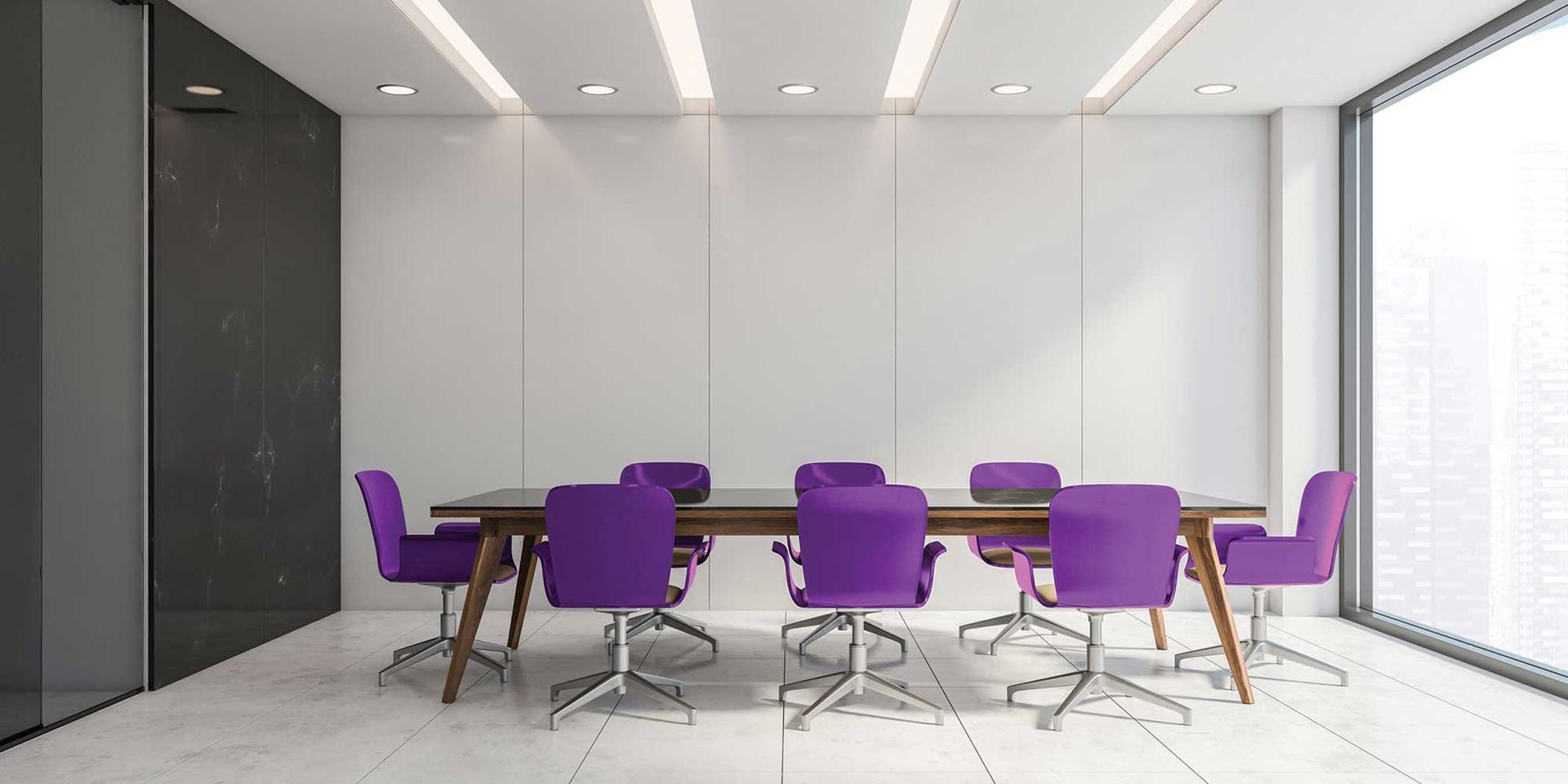 A modern meeting room with a long wooden table, purple chairs, and large windows.