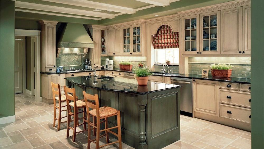 Kitchen with dark green island, light-colored cabinets. Lake Highlands kitchen renovation.