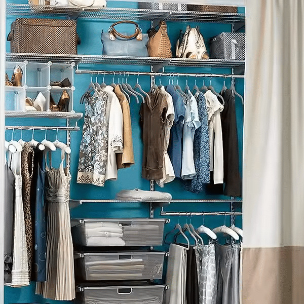 Closet with organized clothing, purses, and storage bins. Blue wall, metal shelving, and beige curtain. — Ezyshelf in Manunda, QLD