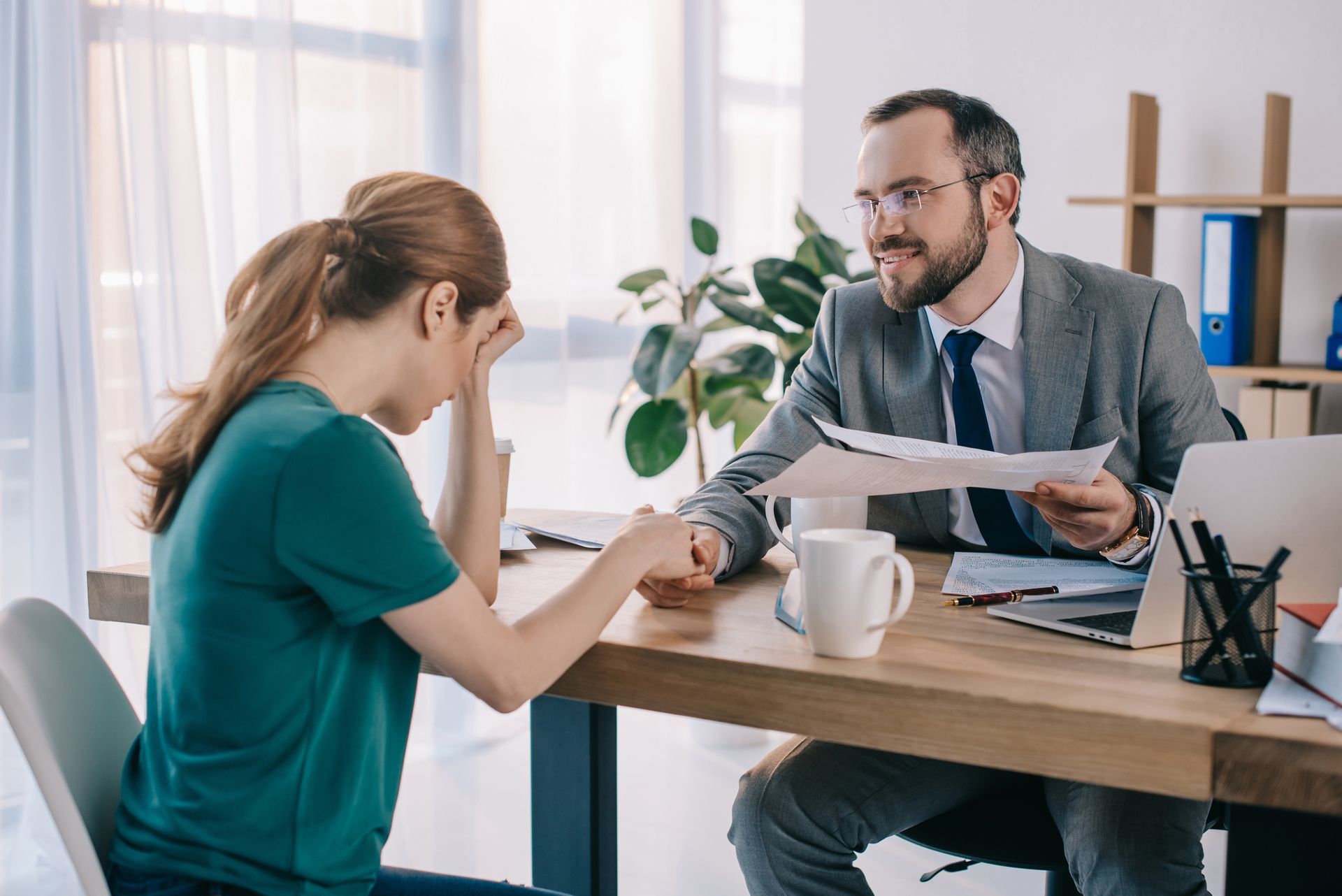 A man and a woman are sitting at a table having a conversation.