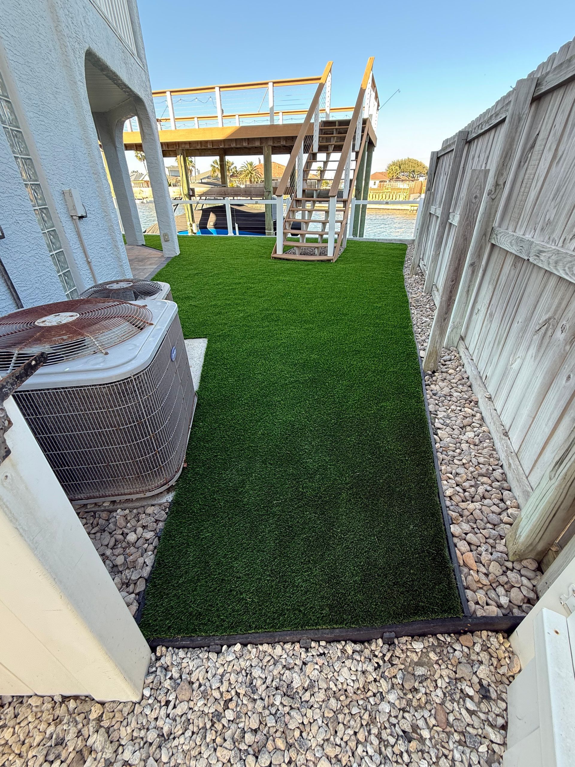 A balcony with a lot of green grass