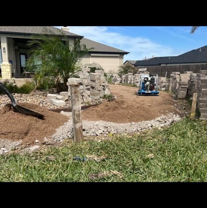 A person is digging in the dirt in front of a house.