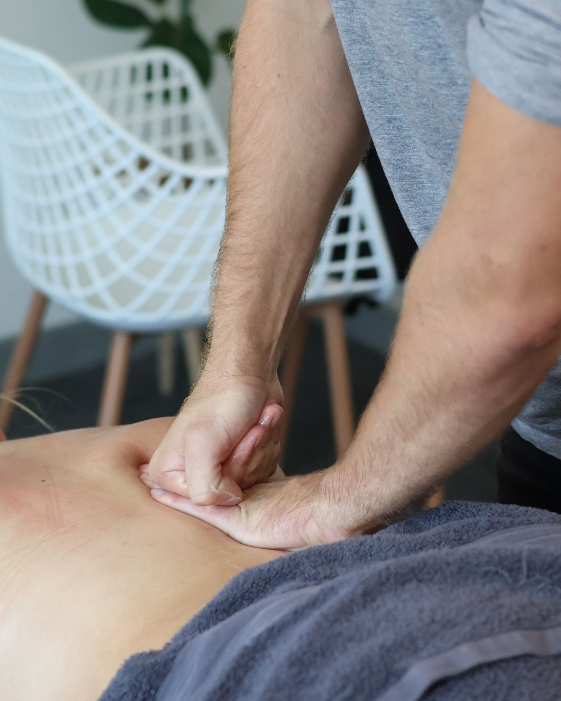 myotherapist performing deep tissue massage for back pain