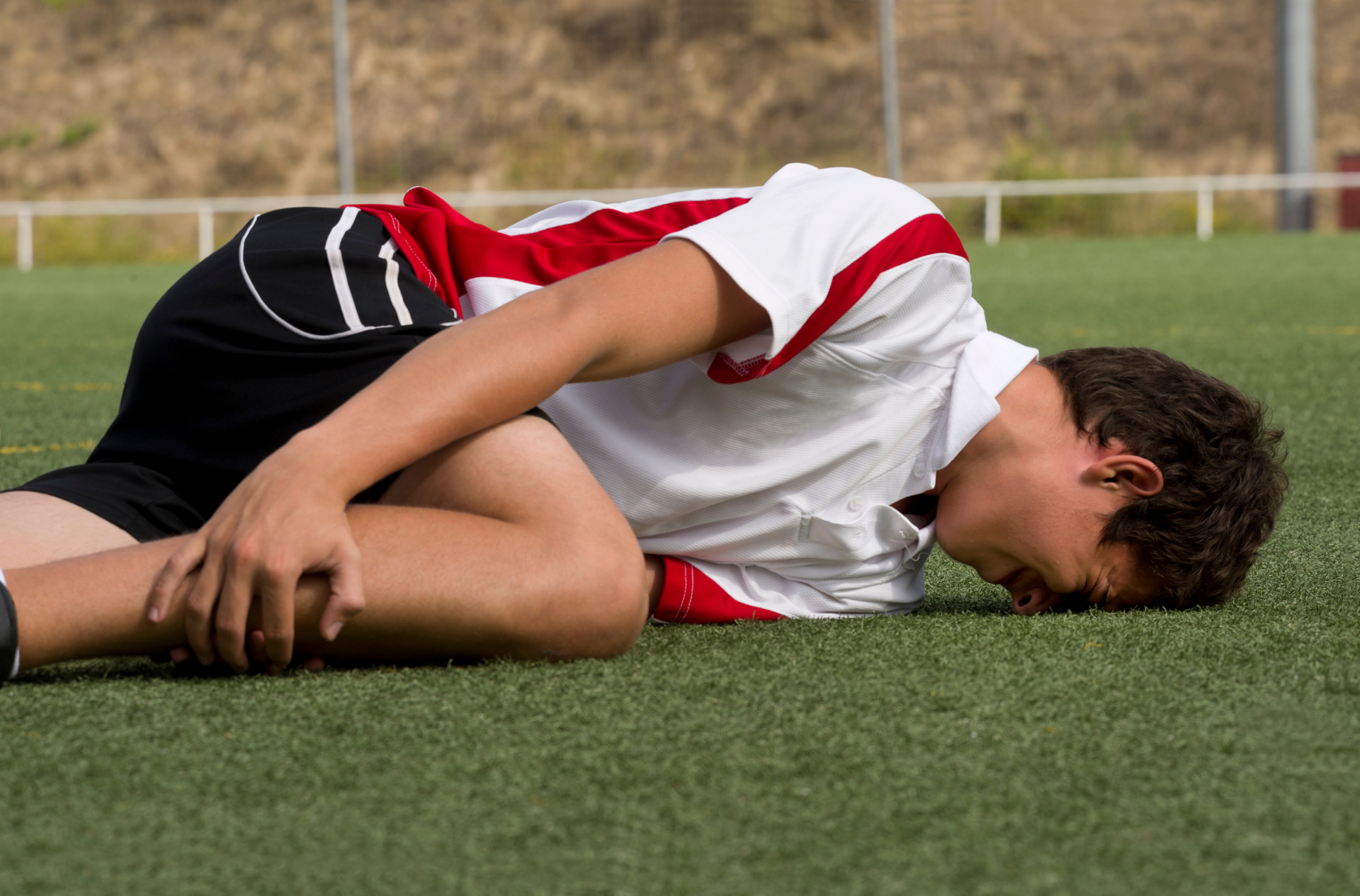 Physiotherapist performing trigger point therapy for neck and shoulder tension