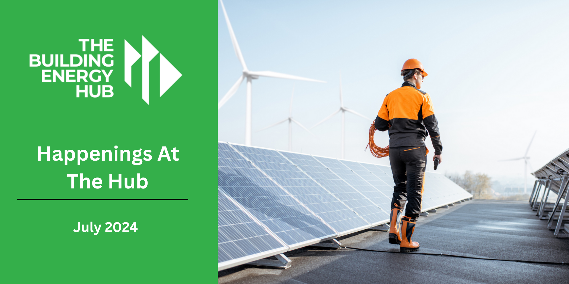 A man is standing on top of a roof with solar panels and wind turbines in the background.