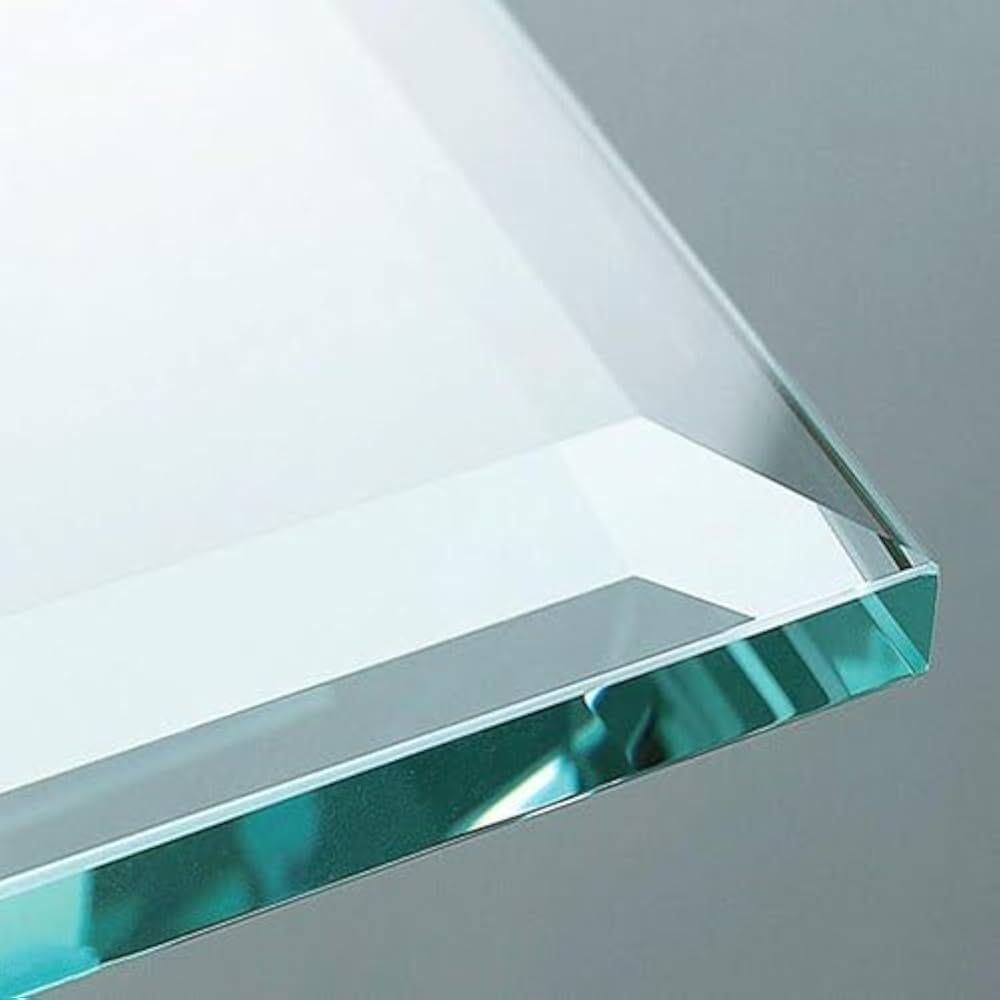 A close up of a piece of clear glass on a table.