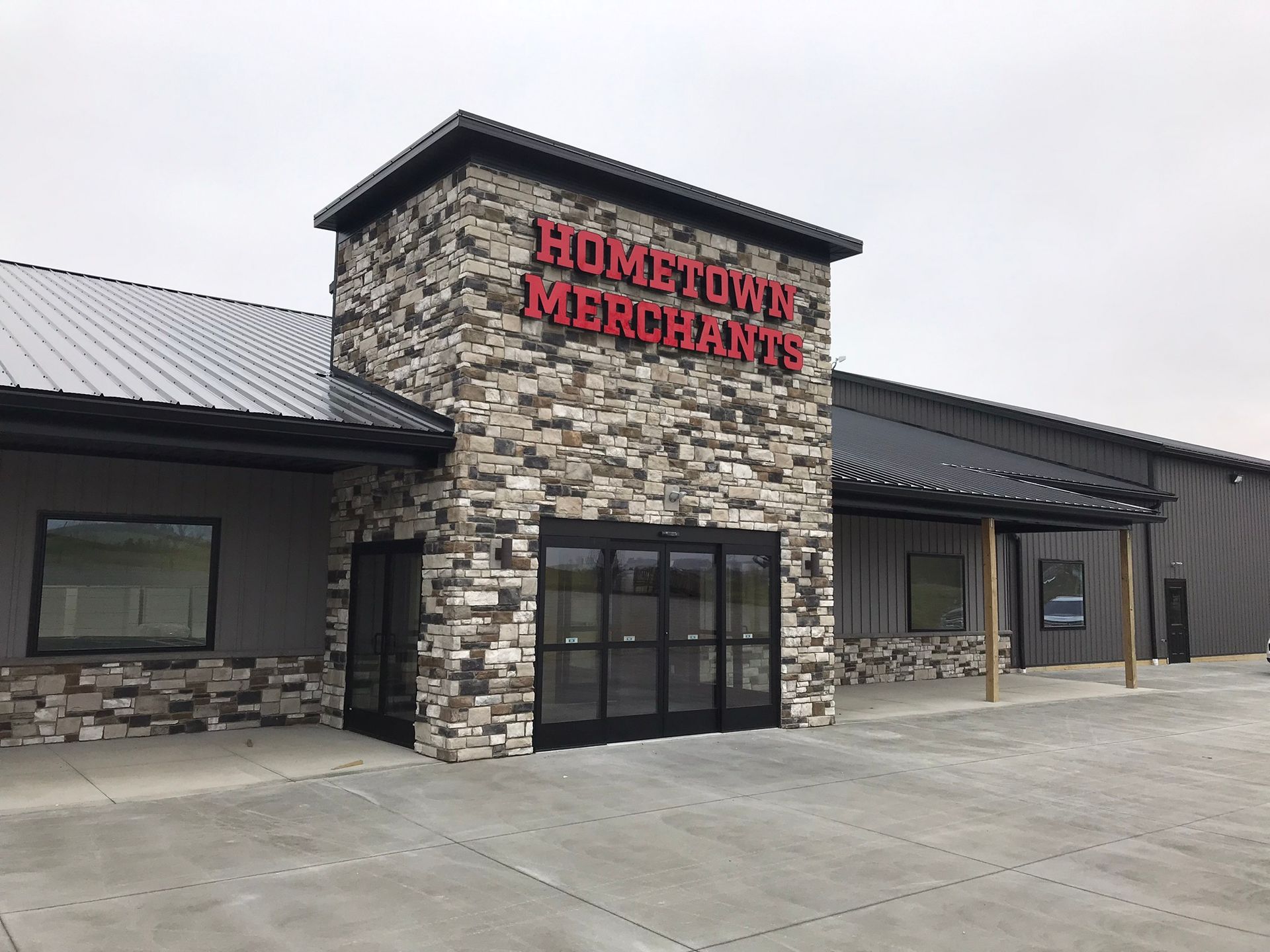 A large building with a sign that says hometown merchants