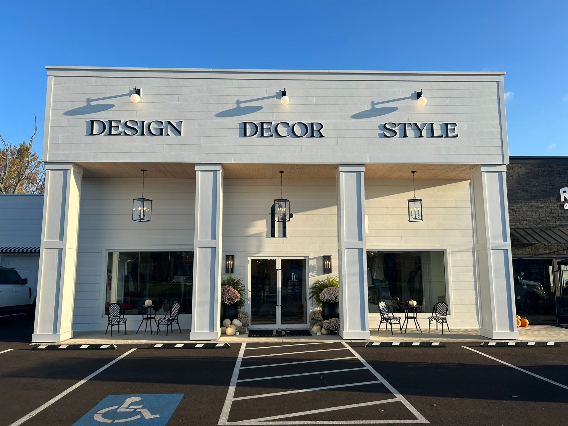 Exterior of a white storefront with 