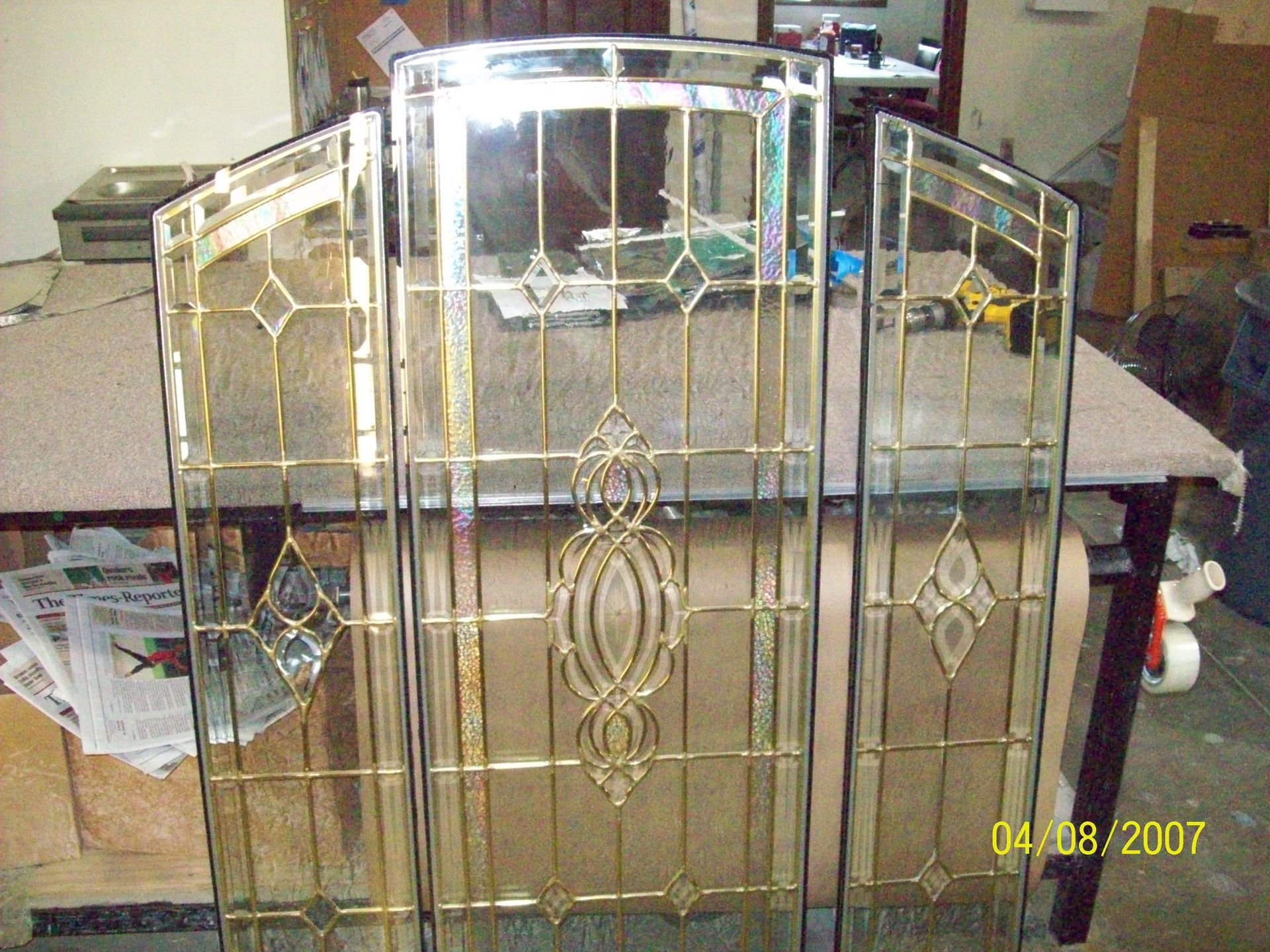 A picture of a stained glass window was taken on april 9th 2007