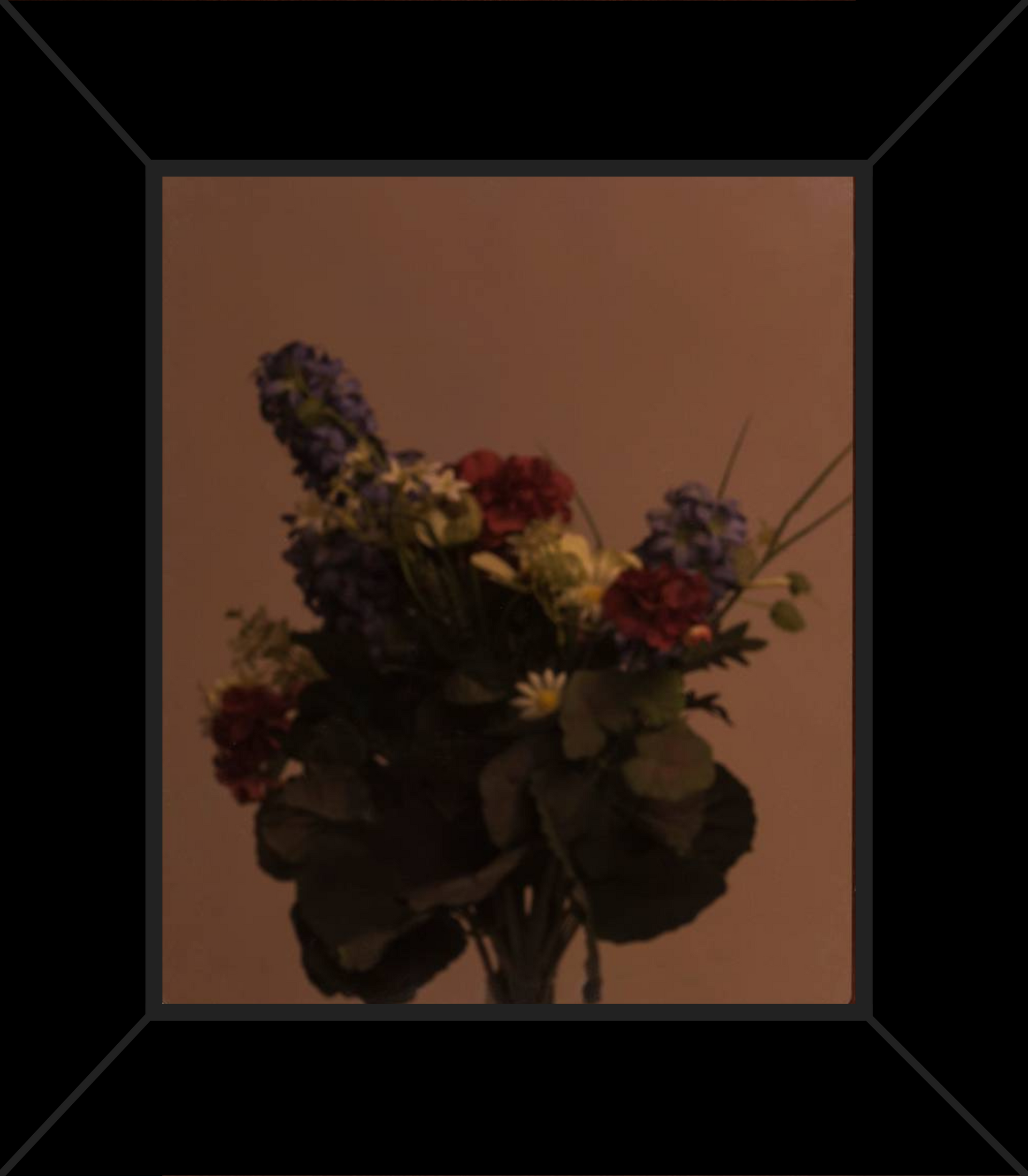 A picture of a bouquet of flowers in a black frame
