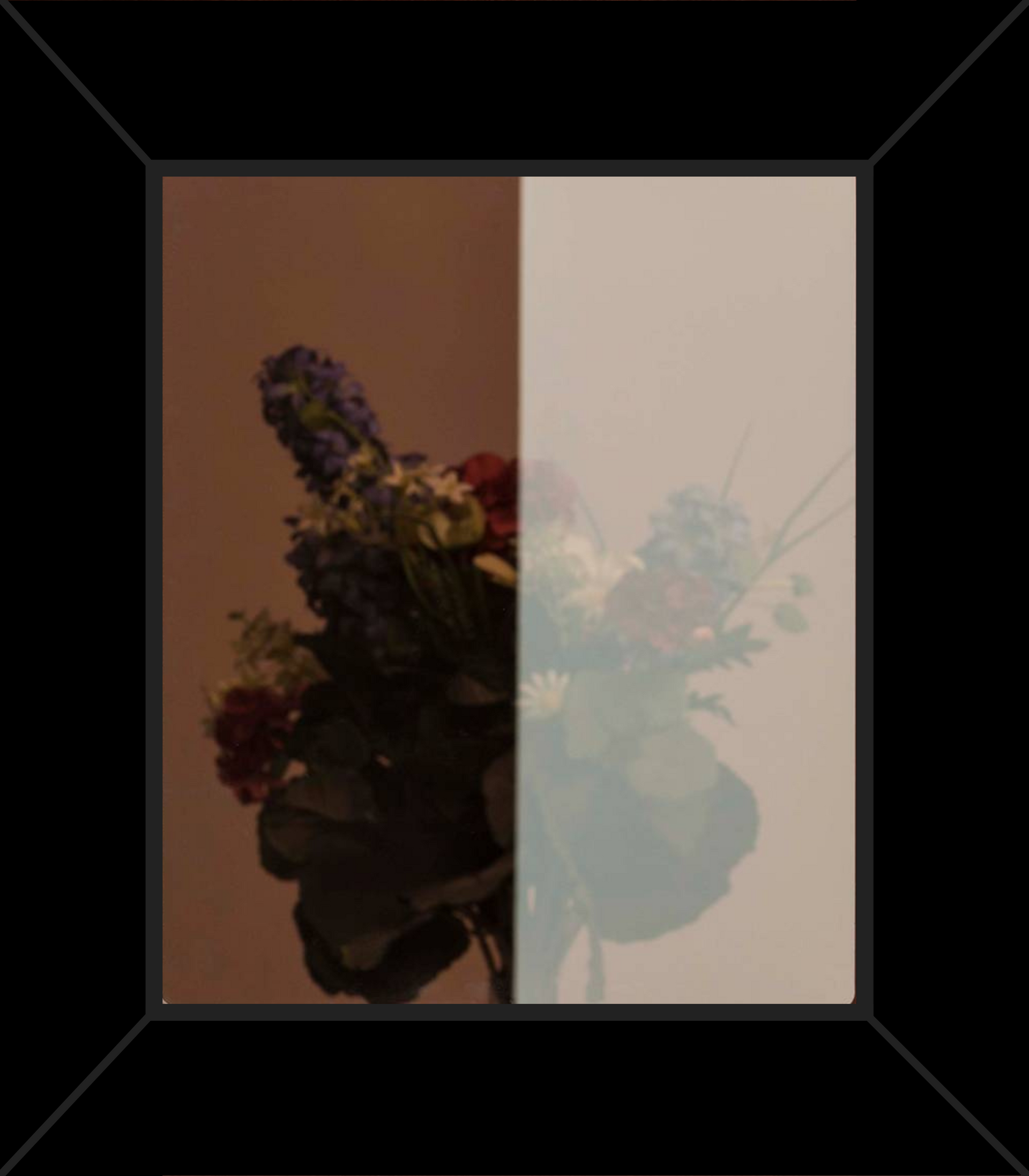 A picture of a bouquet of flowers in a black frame