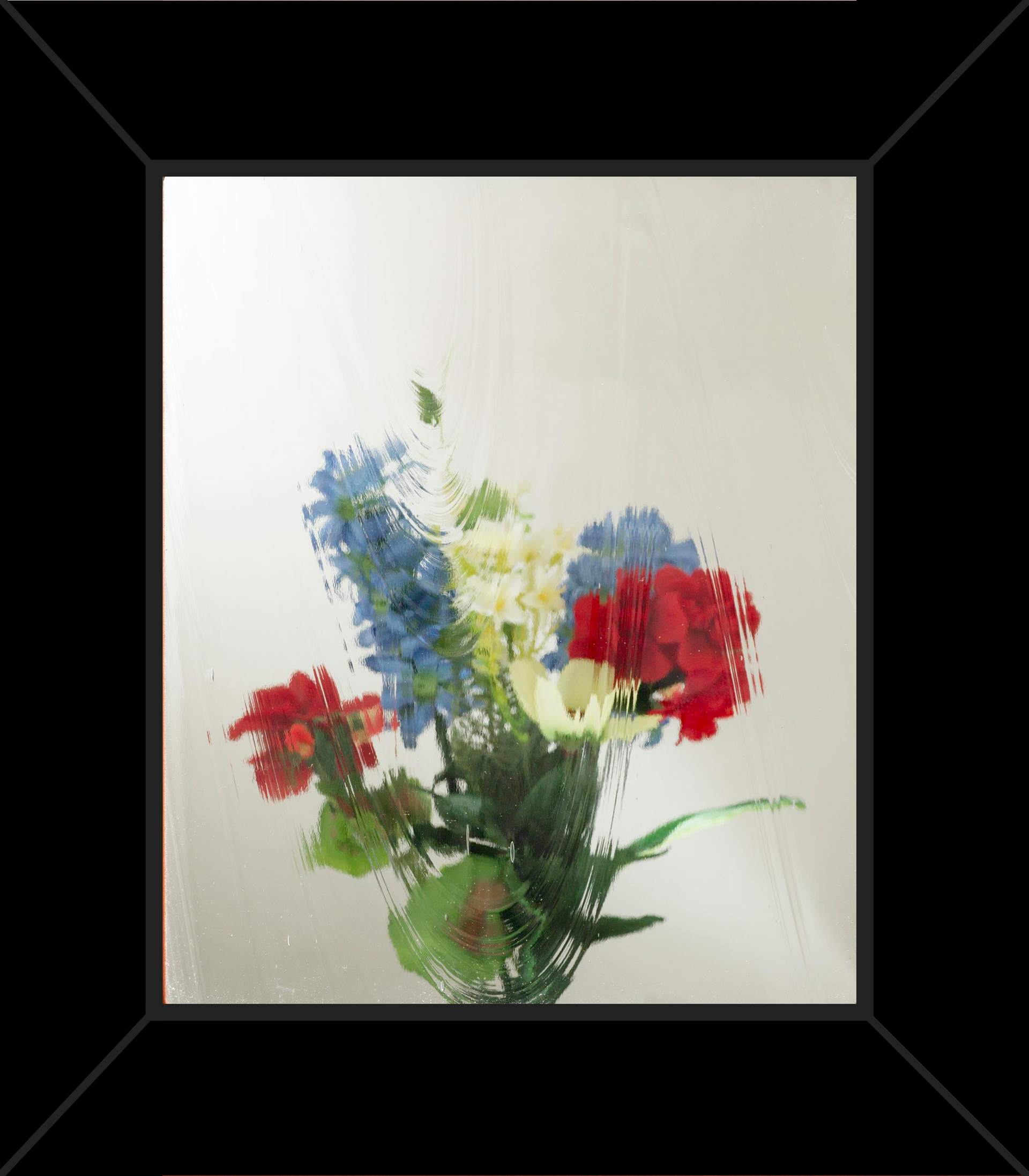 A picture of a bouquet of flowers in a black frame