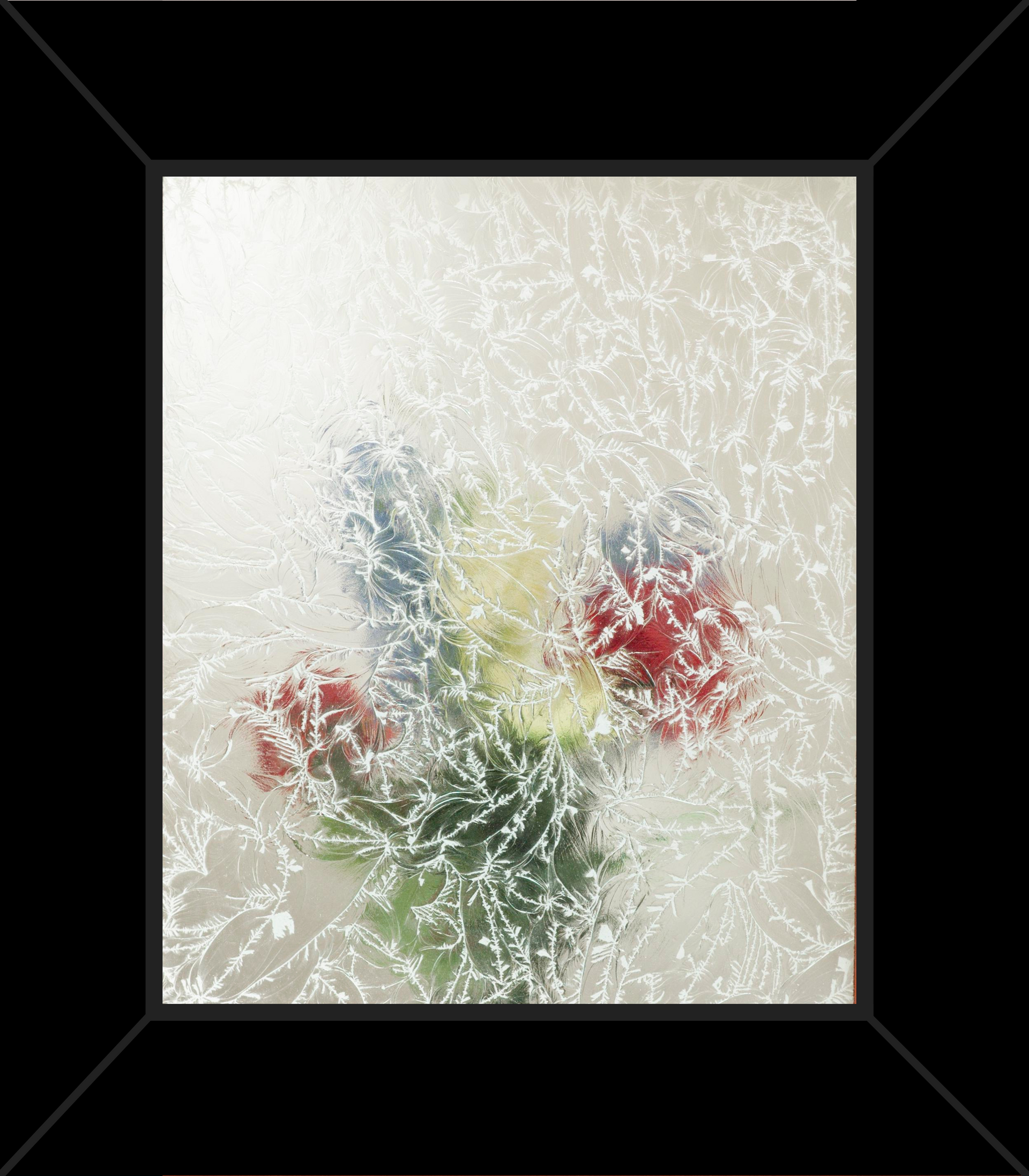 A picture of flowers in a vase in a black frame.