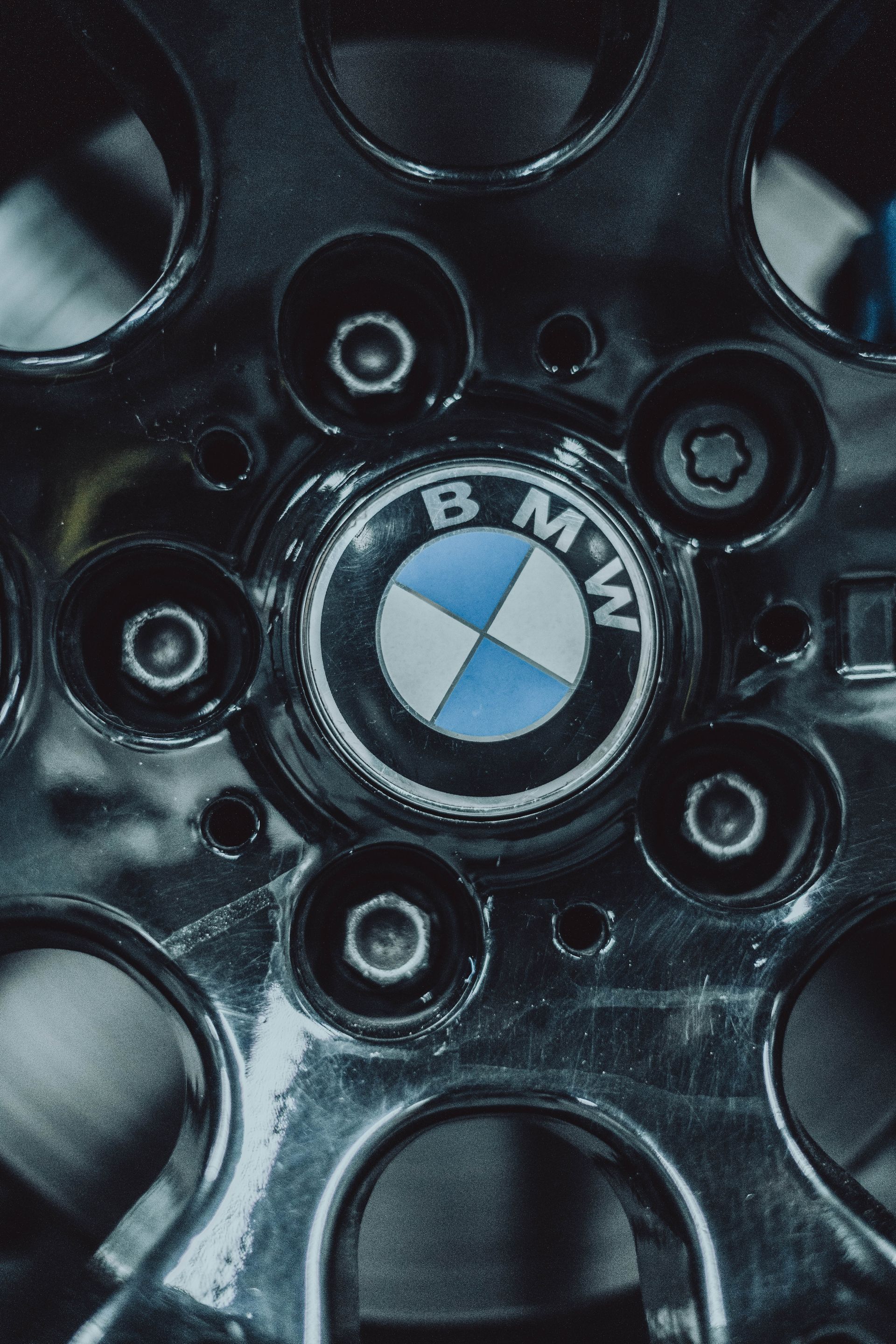 A close up of a bmw logo on a wheel