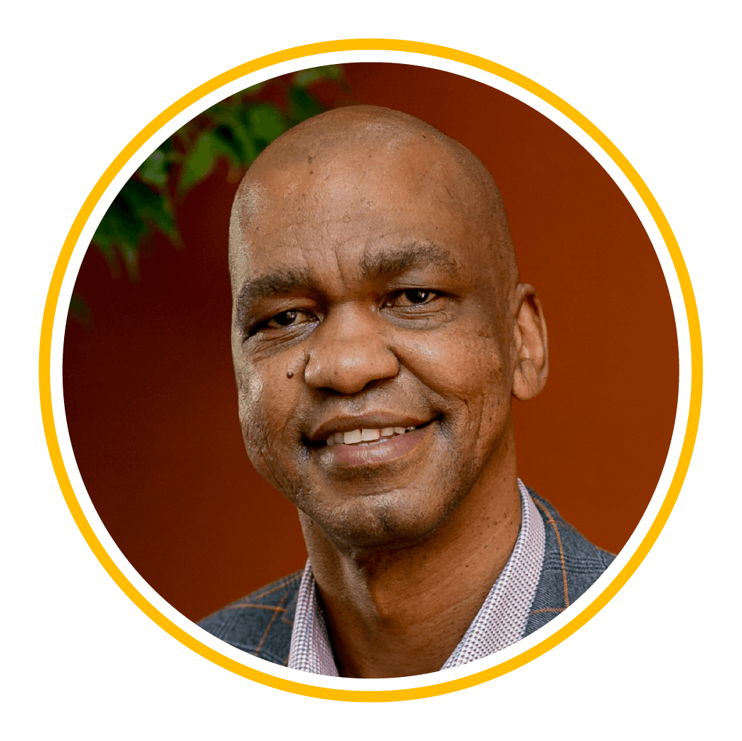 A man is smiling in a circle.