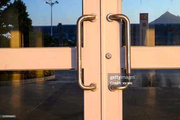 Commercial glass doors at the entrance of a building exterior Commercial glass doors at the entrance of a building exterior