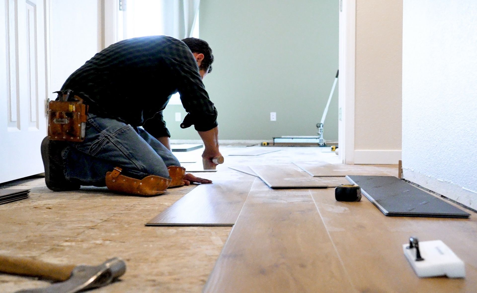 Installing wooden vinyl floor - Ottumwa, IA - Heaven's Best Ottumwa, IA