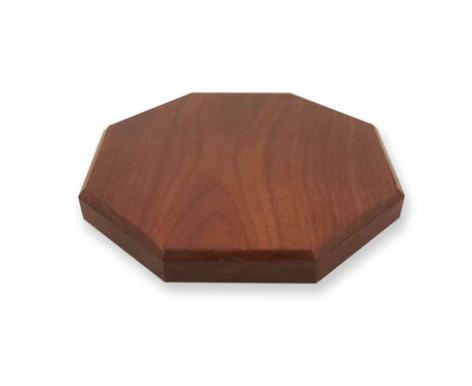 A wooden octagon shaped cutting board on a white background