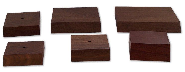 A group of wooden blocks with holes in them on a white background