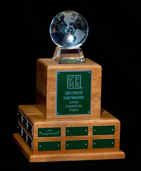 A trophy for george hayward with a globe on top